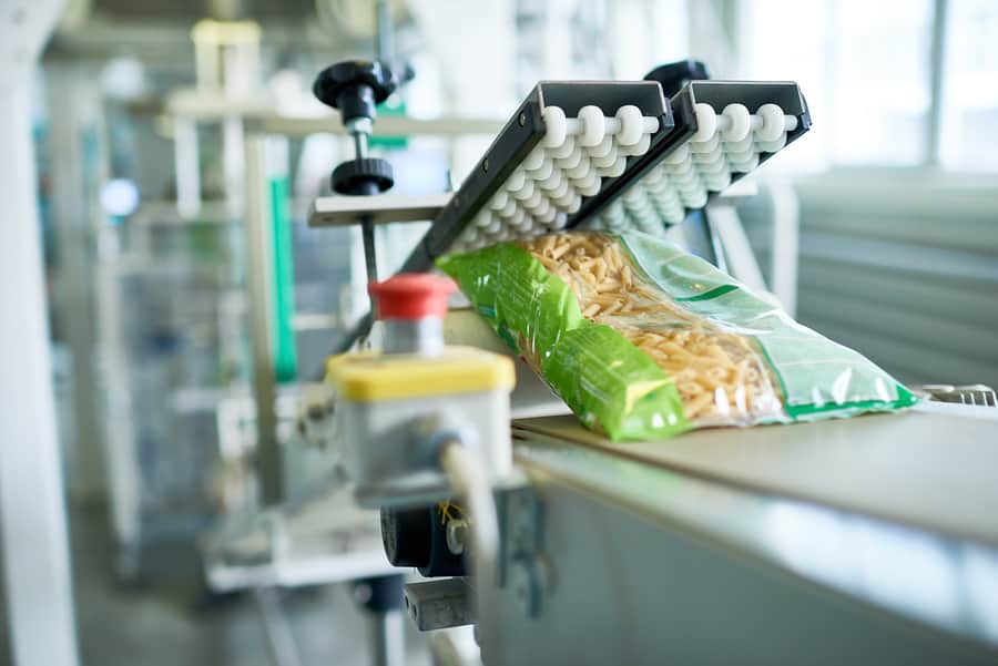 A close up of a bag of macaroni at a food processing plant. 