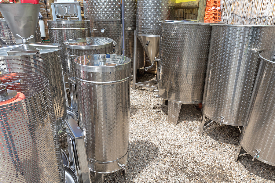 A collection of used stainless-steel tanks.