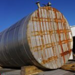 10,000 GALLON STAINLESS STEEL VERTICAL SINGLE SHELL STORAGE TANK