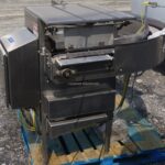 SHRINK WRAP INFEED CONVEYOR COALATOR